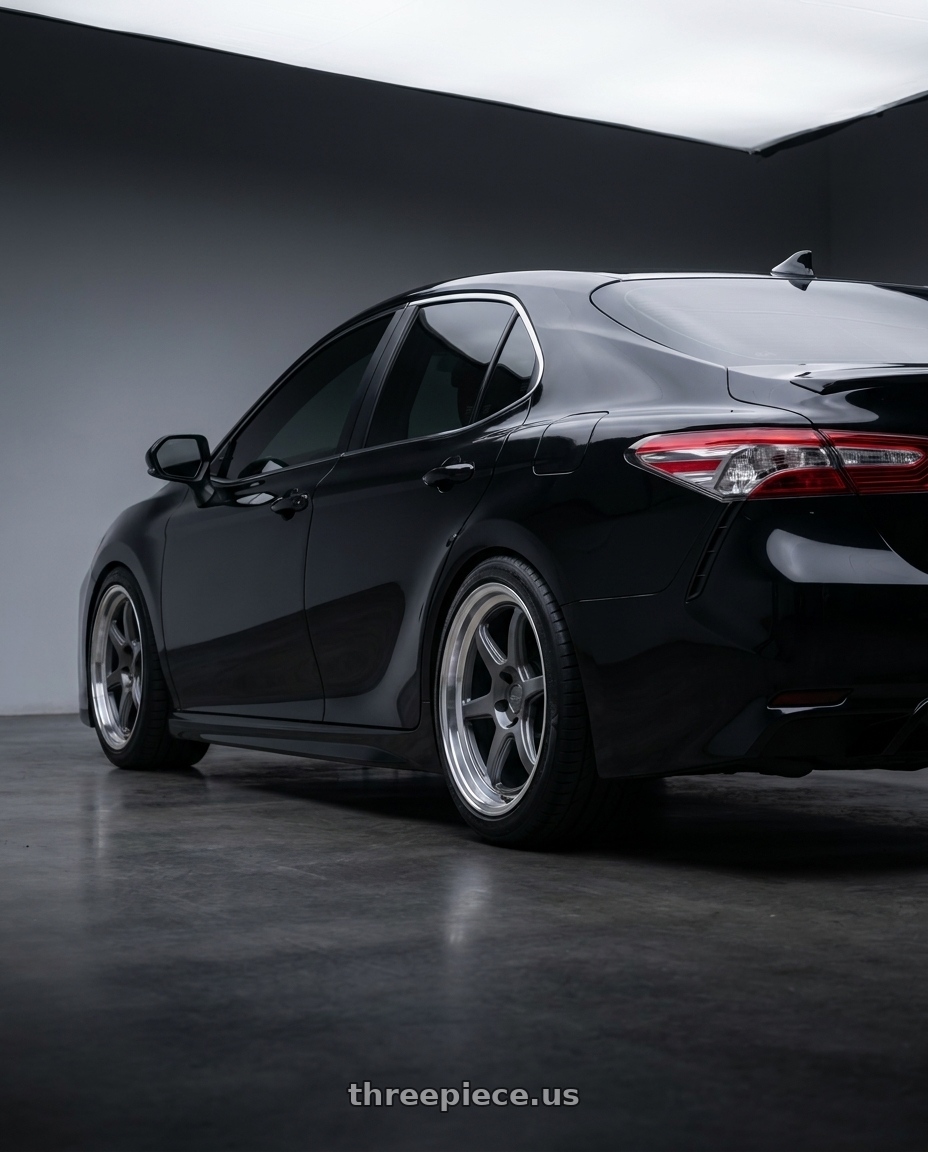 2023 Toyota Camry SE midnight black with Kansei K14G Roku 5X110 18x9.5 22 Grey and Machined Lip wheels rear three quarter view meaty tires
