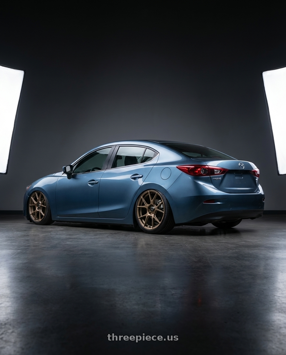 2016 mazda 3 with Konig Ampliform 5x114.3 19x8.5+45 Gloss Bronze wheels rear three quarter view slight stretch tires