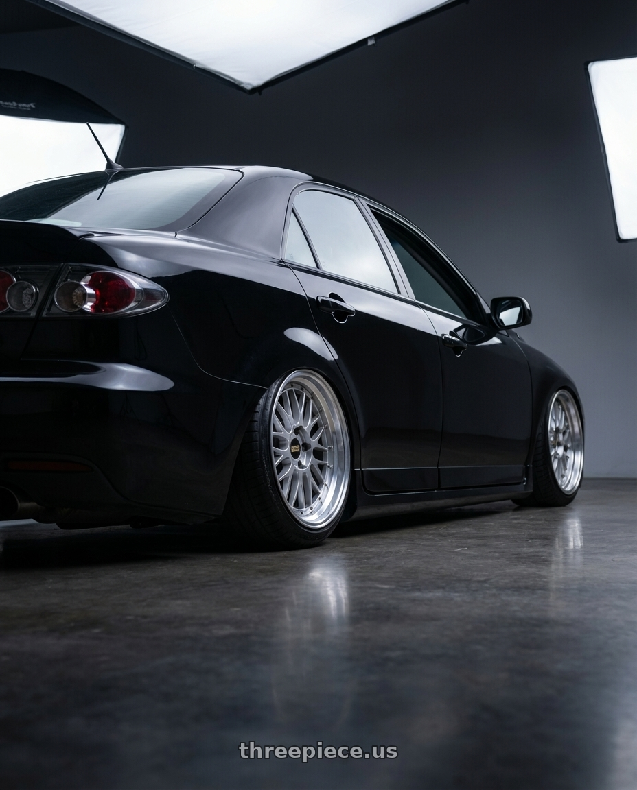 2006 Mazda, Mazdaspeed 6, Grand Touring, Black with BBS LM 5x114.3 18x8.5+38 Diamond Silver wheels rear three quarter view slight stretch tires