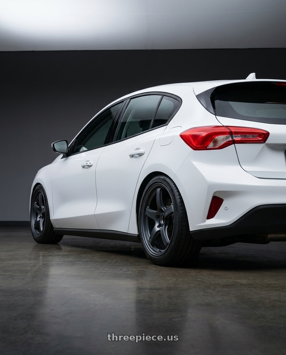 2021 Ford Focus Trend with Gram Lights 57CR 5x100 18x9.5+38 Gunblue II wheels rear three quarter view square tires