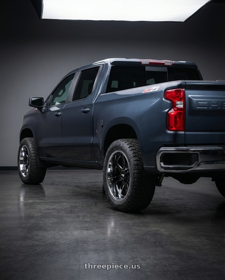 2023 Chevrolet Silverado 1500 with Moto Metal MO200 6X139.7 20X10 -18 GLOSS BLACK MILLED CENTER CHROME LIP wheels rear three quarter view meaty tires