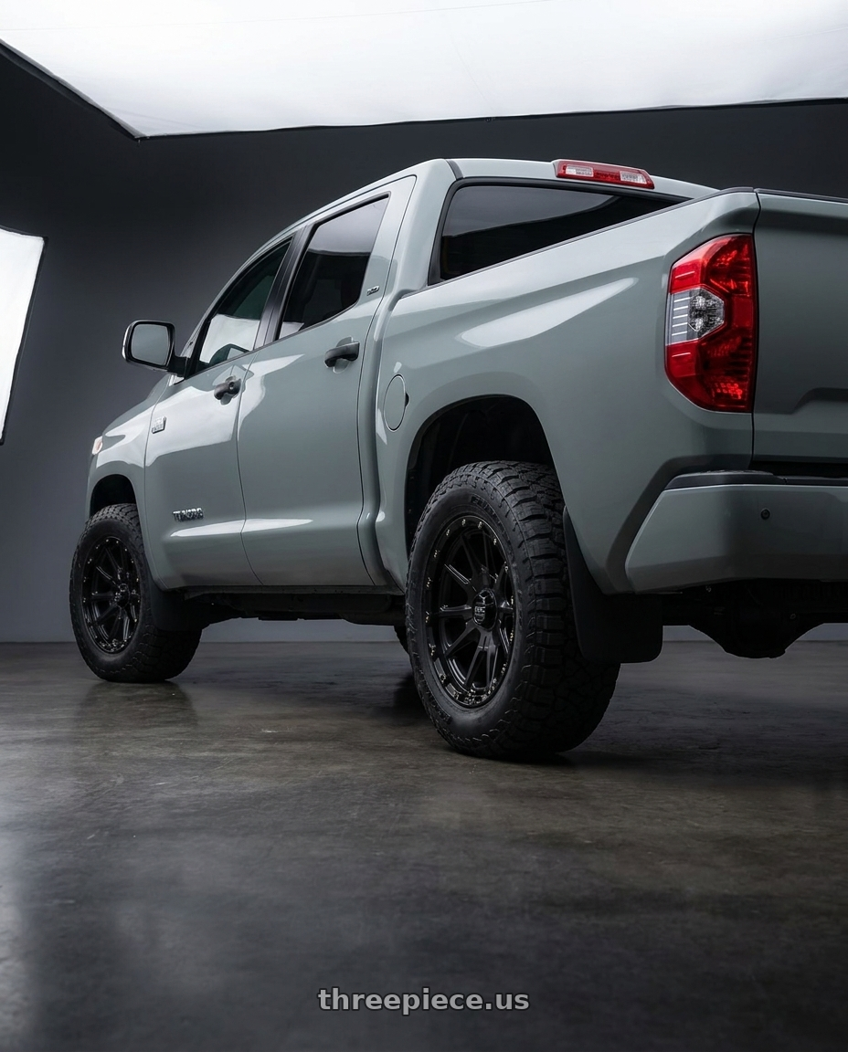 2018 Toyota Tundra with KMC KM100 SYNC 5X150 20X9 +18 SATIN BLACK wheels rear three quarter view meaty tires