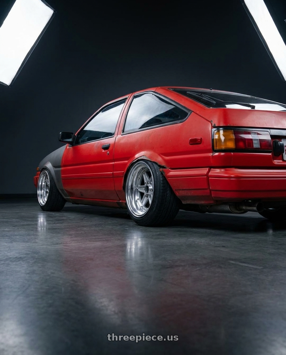 1986 toyta corrola with Speed Star Mk-II 4x110 13X8.5+-7  Silver wheels rear three quarter view extreme stretch tires