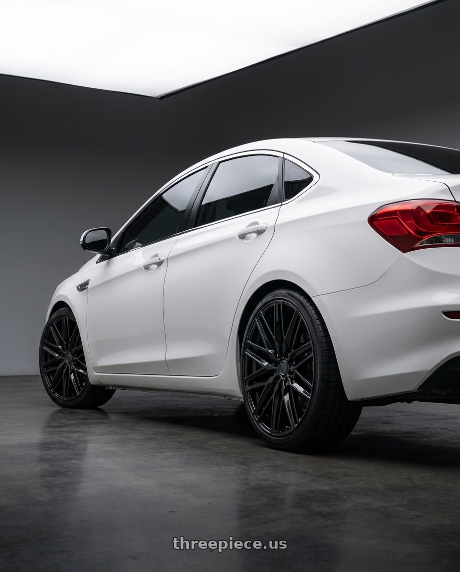 2020 Nissan bluebird with Status ADAMAS 6X135 20X9 +25 GLOSS BLACK wheels rear three quarter view square tires