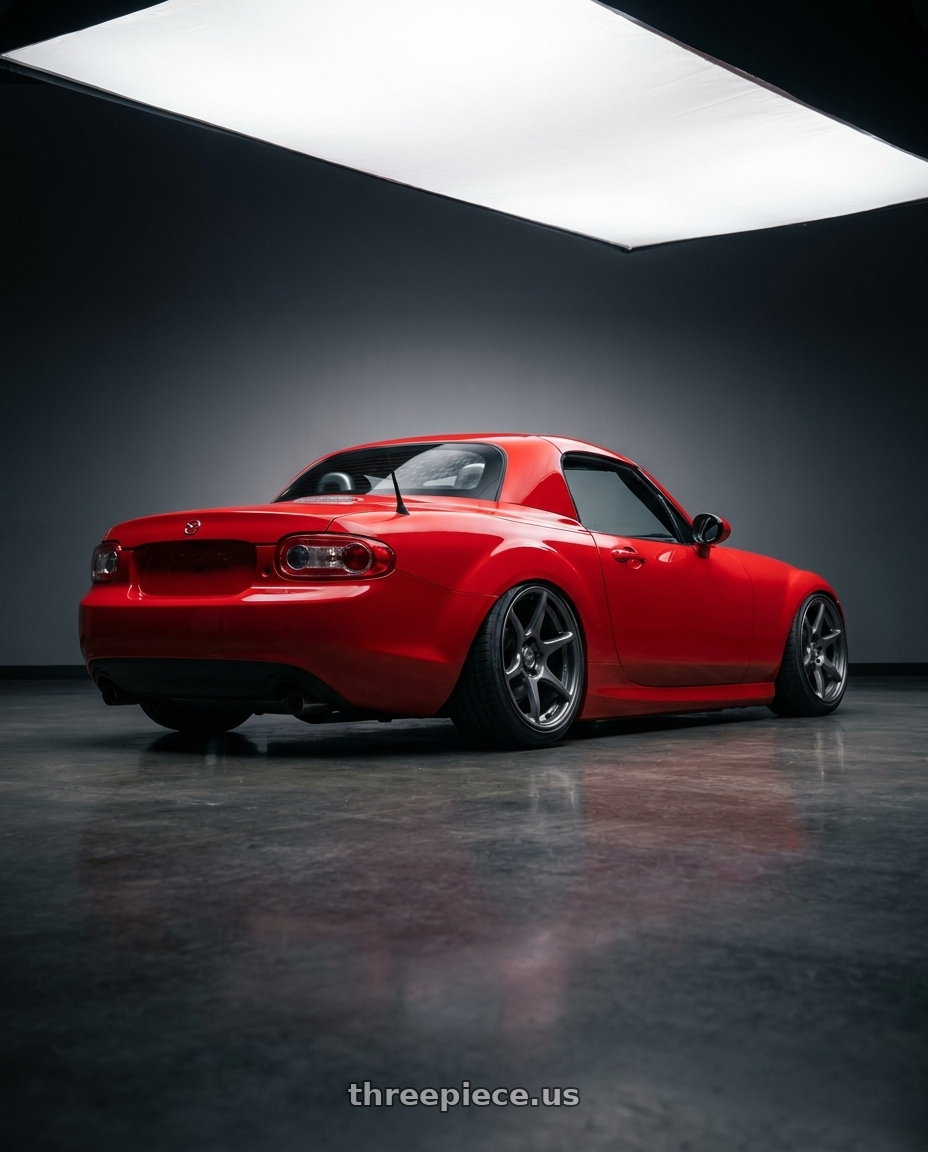 2012 Mazda MX-5 Miata NC with Kansei K11G Tandem 5x114.3 17x9 22 Gunmetal wheels rear three quarter view slight stretch tires