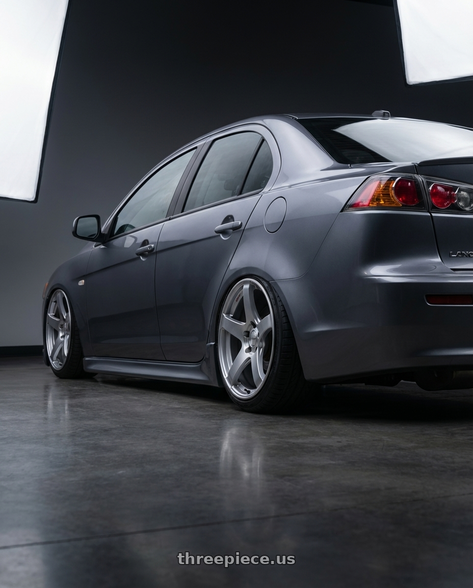 2014 Mitsubishi Lancer Ralliart with Ssr Gtv01 5x114.3 18x9+35  GLARE SILVER wheels rear three quarter view slight stretch tires