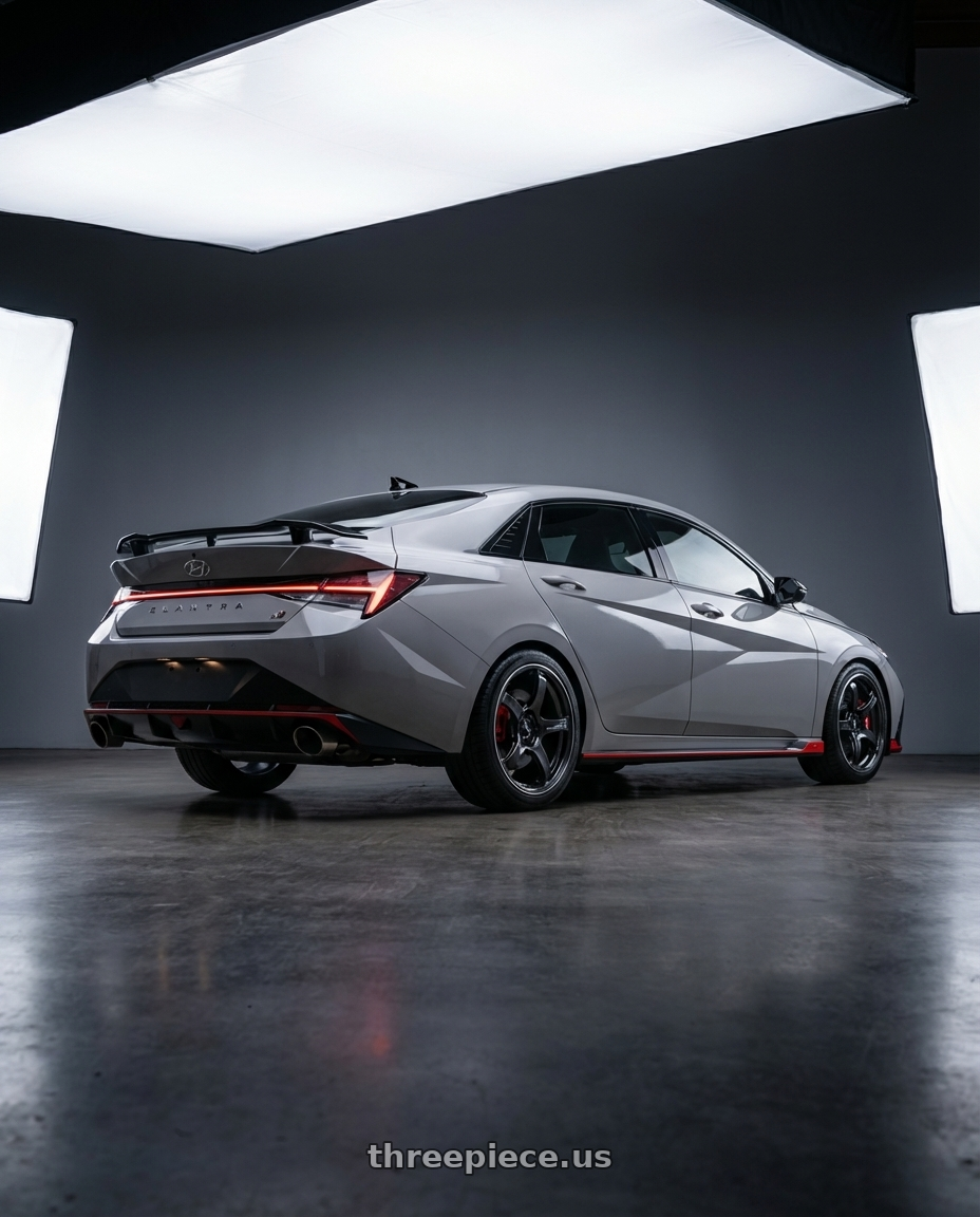 2024 Hyundai Elantra N with Advan Racing TC4 5x114.3 18x8.5 +45 BLACK GUNMETALLIC & RING wheels rear three quarter view square tires