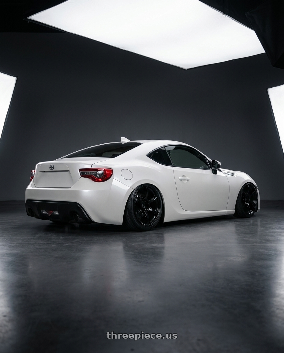 2016 Scion FR-S with Advan RGIII 5x100 18x7.5+50 Gloss Black wheels rear three quarter view slight stretch tires