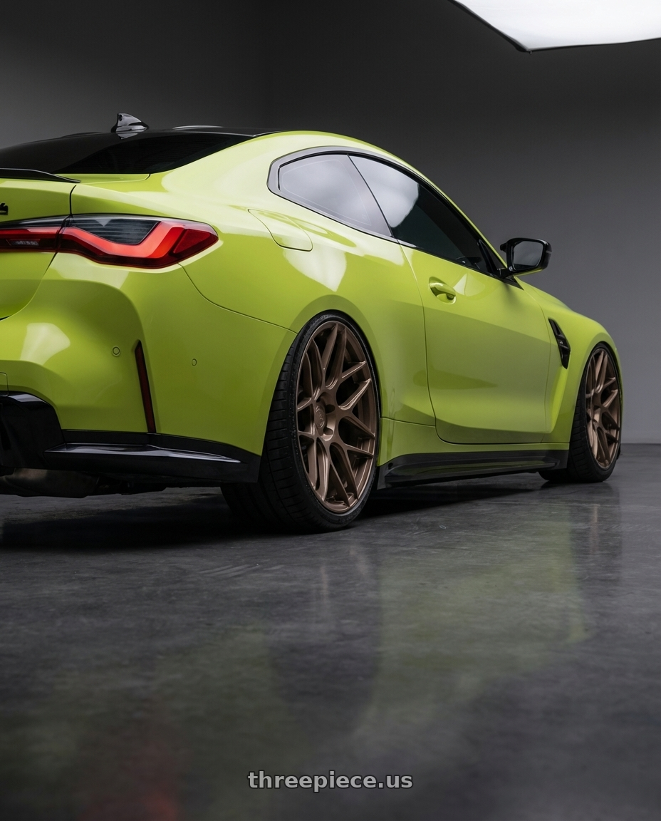 2024 BMW M4 G82 with Aodhan AFF2 5x112 19x8.5+35 Matte Bronze wheels rear three quarter view slight stretch tires