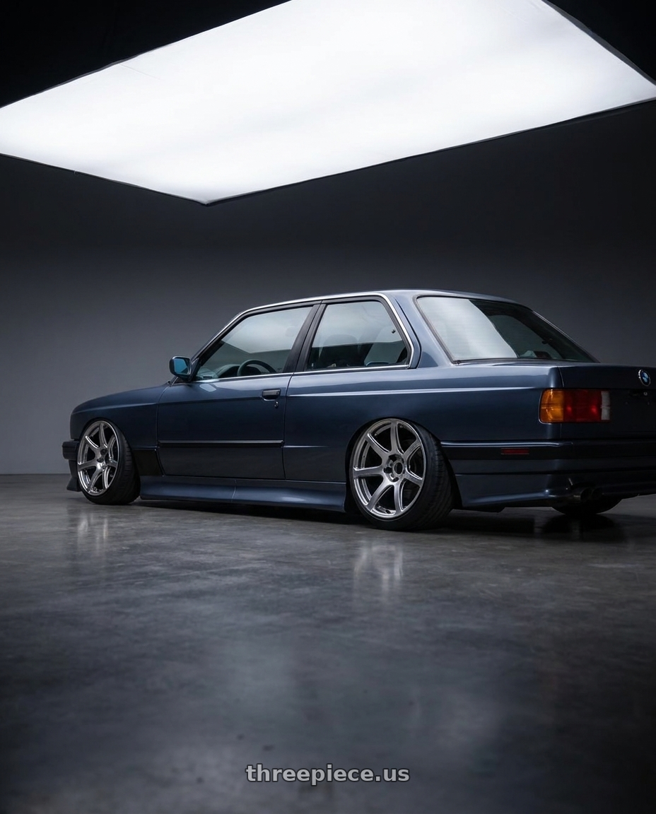 1989 BMW 325i with Work Emotion T7r 5x100 18x8.5 +45 Gt Silver wheels rear three quarter view slight stretch tires