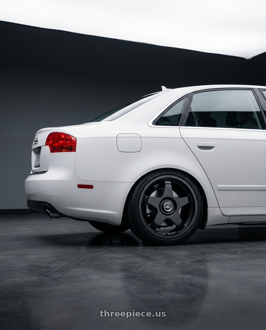 2010 Audi A4 B7 with fifteen52 CHICANE 5x112 / 5x120 18x8.5 +35 ASPHALT BLACK (SATIN BLACK) wheels rear three quarter view square tires