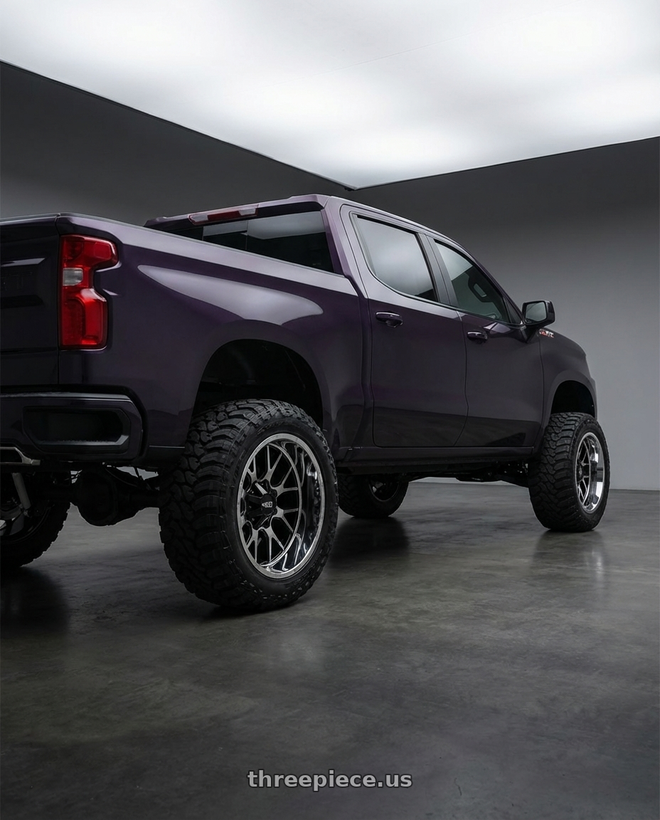 2023 Chevrolet Silverado 1500 with Moto Metal MO202 6X139.7 22X10 -18 GLOSS BLACK MACHINED CENTER CHROME LIP wheels rear three quarter view meaty tires