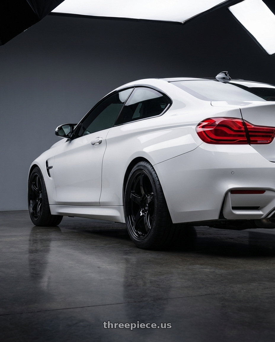 2018 BMW M4 F82 with Gram Lights 57CR 5x120 19x10.5+22 Glossy Black wheels rear three quarter view square tires
