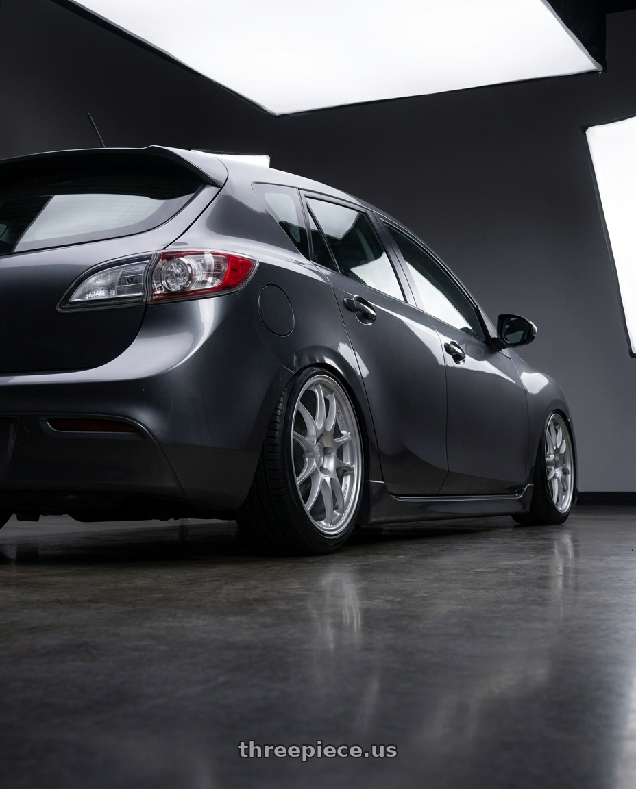 2011 Mazda 3 hatch with Enkei PF01 5x114.3 17x9+48 Silver wheels rear three quarter view slight stretch tires