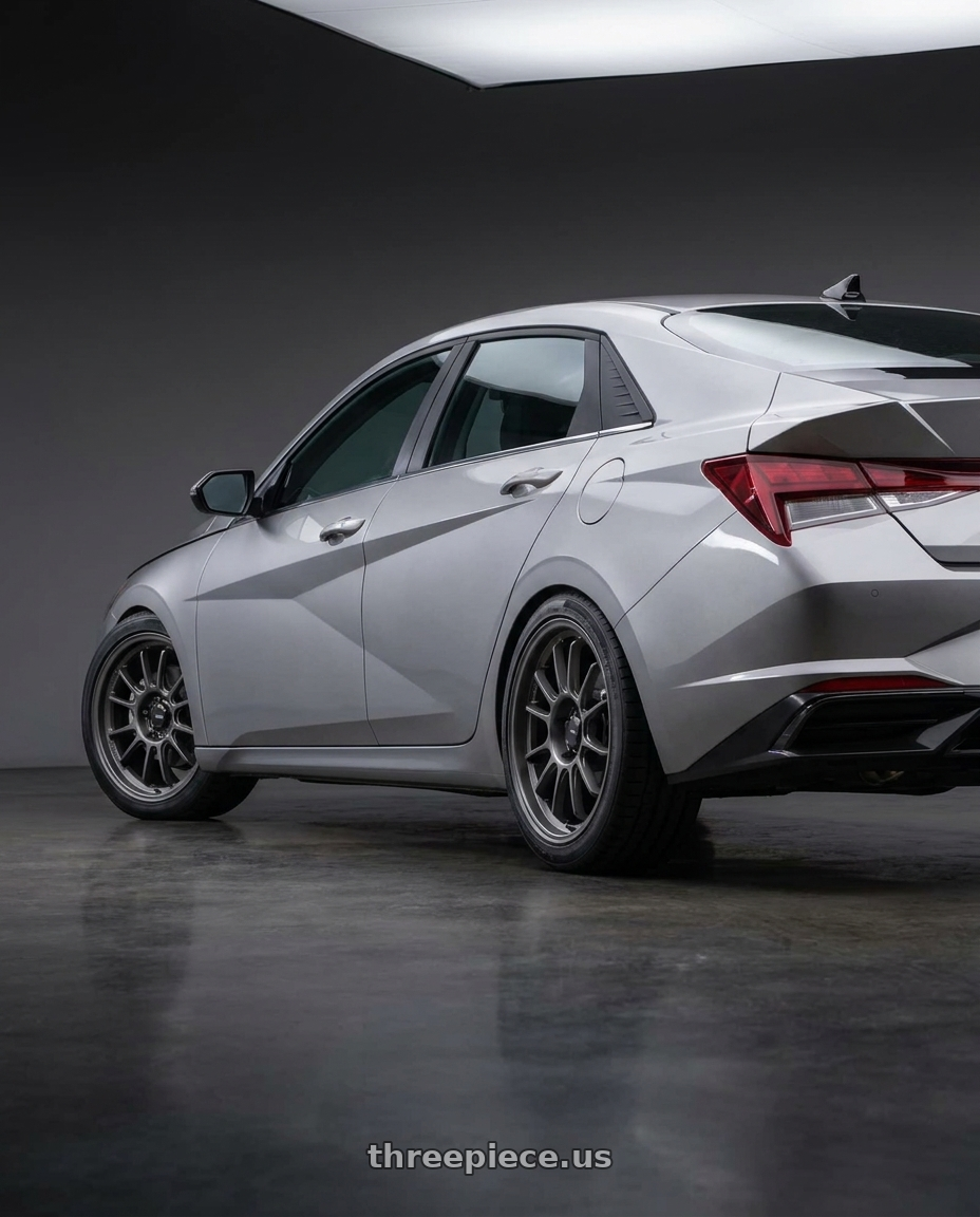 2021 Hyundai Elantra Limited with Konig Hypergram 5x114.3 18x9.5+35 Matte Grey wheels rear three quarter view square tires