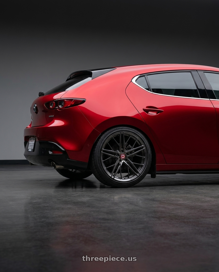 2024 Mazda 3 with Avant Garde Wheels F53R BLANK 19x8.5 +BLANK Dark Graphite Metallic wheels rear three quarter view slight stretch tires