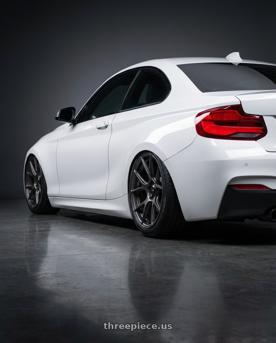 2018 BMW 2 Series F22 with Konig Ampliform 5x120 19x10+28 Dark Metallic Graphite wheels rear three quarter view slight stretch tires