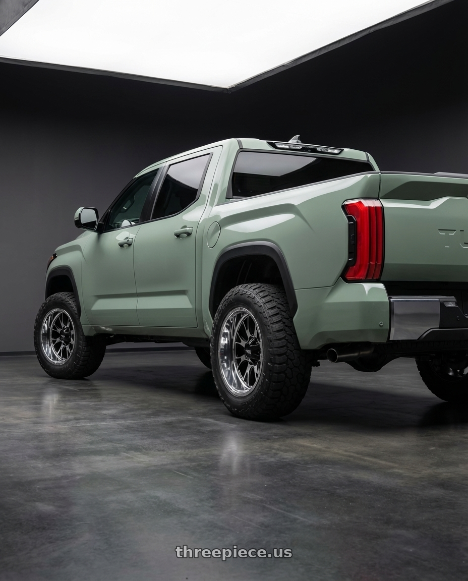 2024 Toyota Tundra with Moto Metal MO202 6X139.7 20X10 -18 GLOSS BLACK MACHINED CENTER CHROME LIP wheels rear three quarter view meaty tires