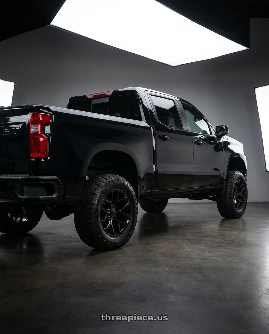 2020 Chevy Silverado 1500 Z71 with OE Wheels CV98B 6x139.7 20x9+24 Gloss Black wheels rear three quarter view meaty tires