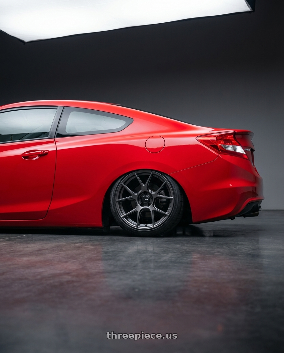 2015 Honda Civic Si with Konig Ampliform 5x114.3 18x9.5+25 Dark Metallic Graphite wheels rear three quarter view slight stretch tires