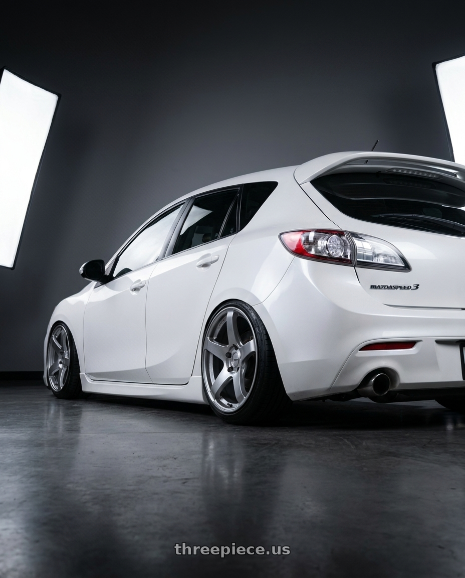 2012 Mazda Mazdaspeed3 with Ssr Gtv01 5x114.3 18x8.5+40  GLARE SILVER wheels rear three quarter view slight stretch tires