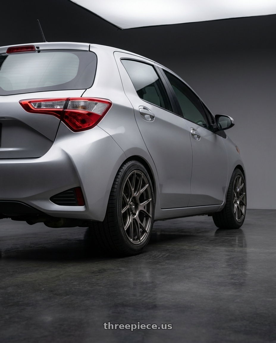 2020 Toyota Yaris with Konig Ampliform 5x112 18x8.5+43 Dark Metallic Graphite wheels rear three quarter view square tires