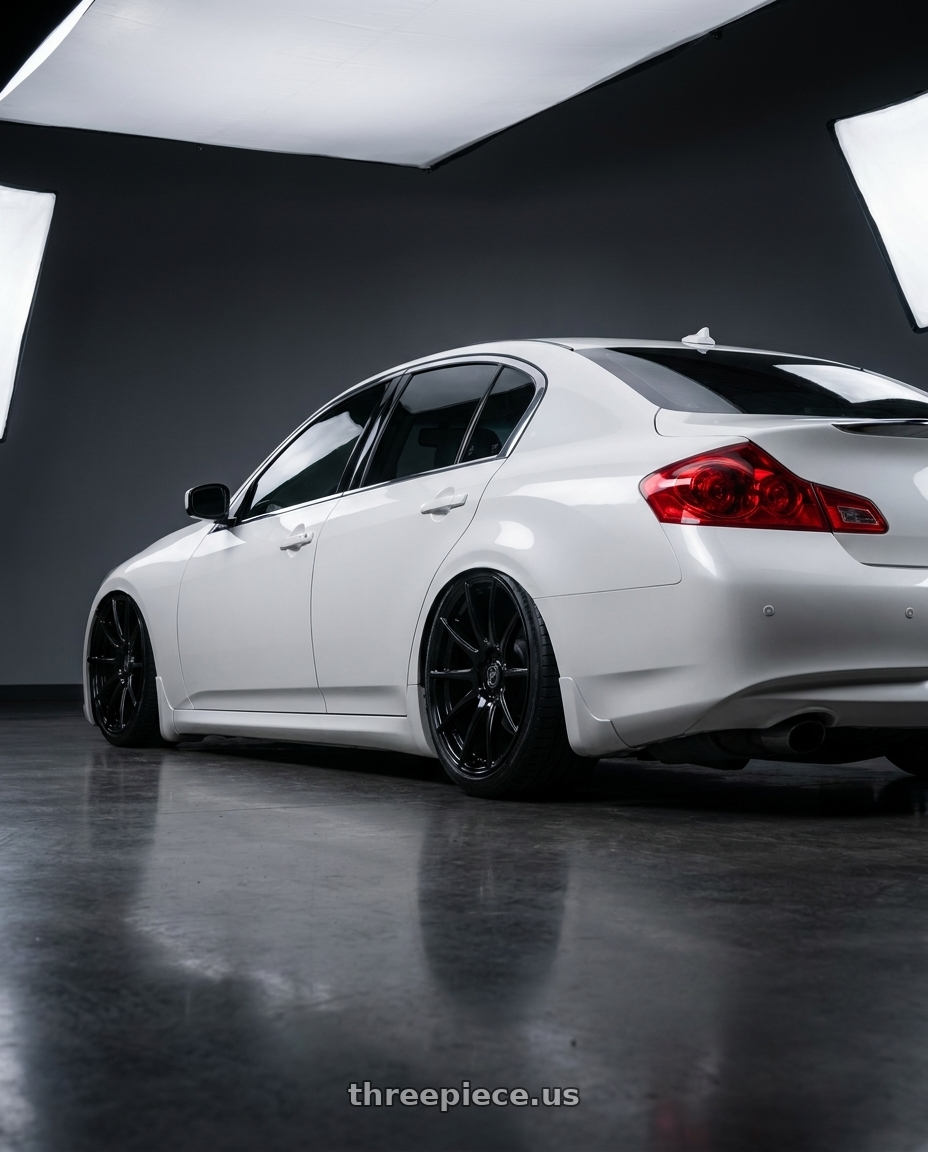 2012 Infiniti G37 with Forgestar CF10 5x114.3 19x9.5 +29 Gloss Black wheels rear three quarter view slight stretch tires