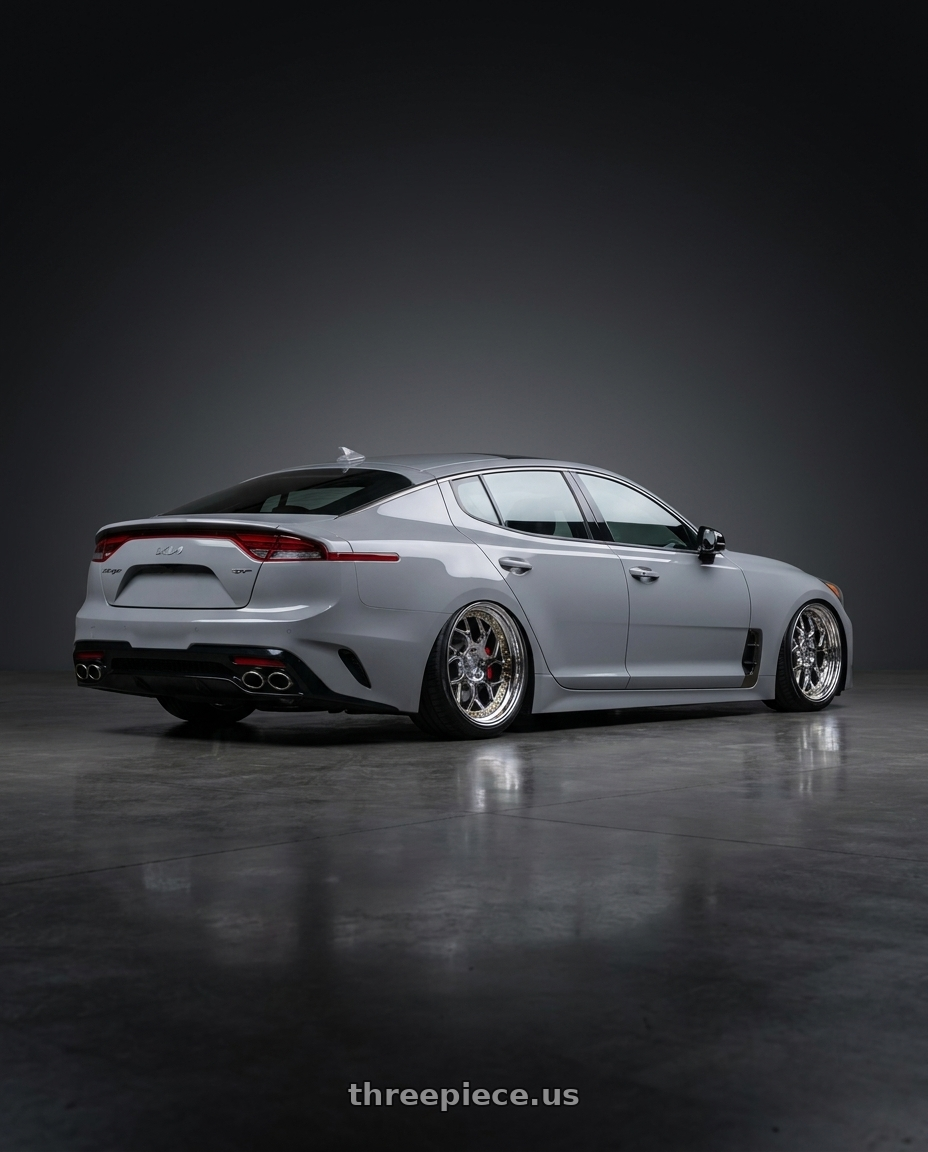 2023 Kia stinger gt2 with Aodhan DS01 5x100 18x8.5+35 Vacuum Chrome W/ Gold Rivets wheels rear three quarter view square tires