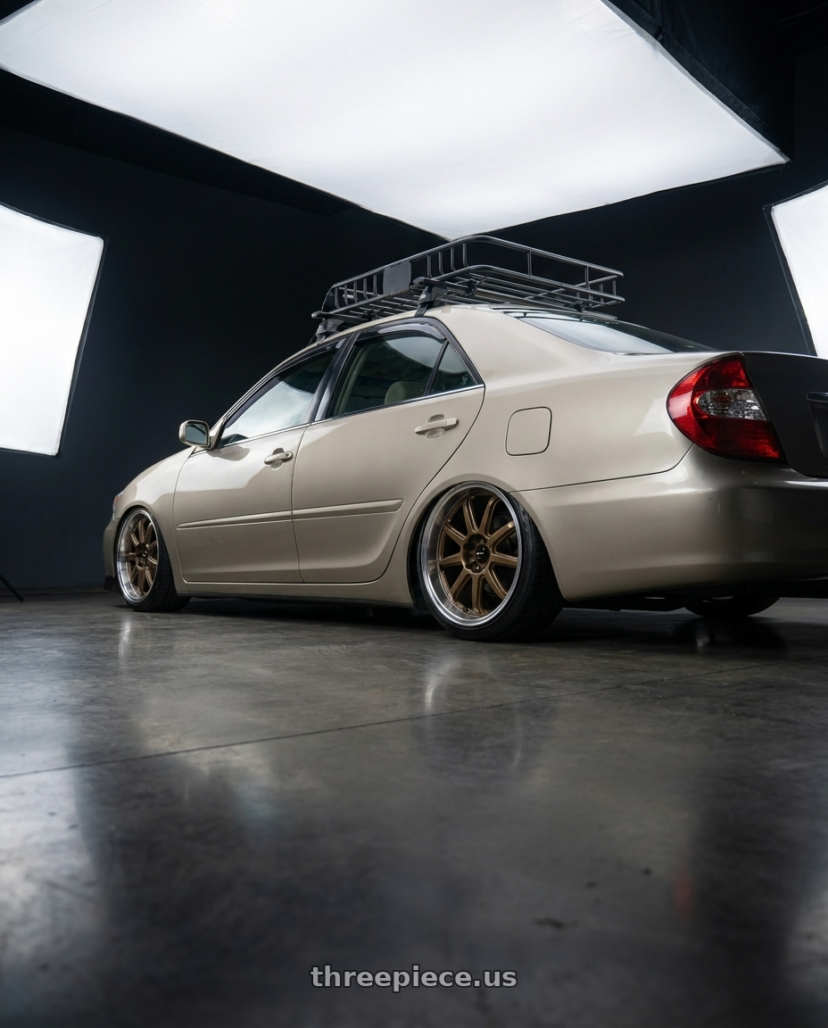 2003 Toyota Camry with Vors SP2 5x114.3 17x8 +35 Bronze wheels rear three quarter view square tires
