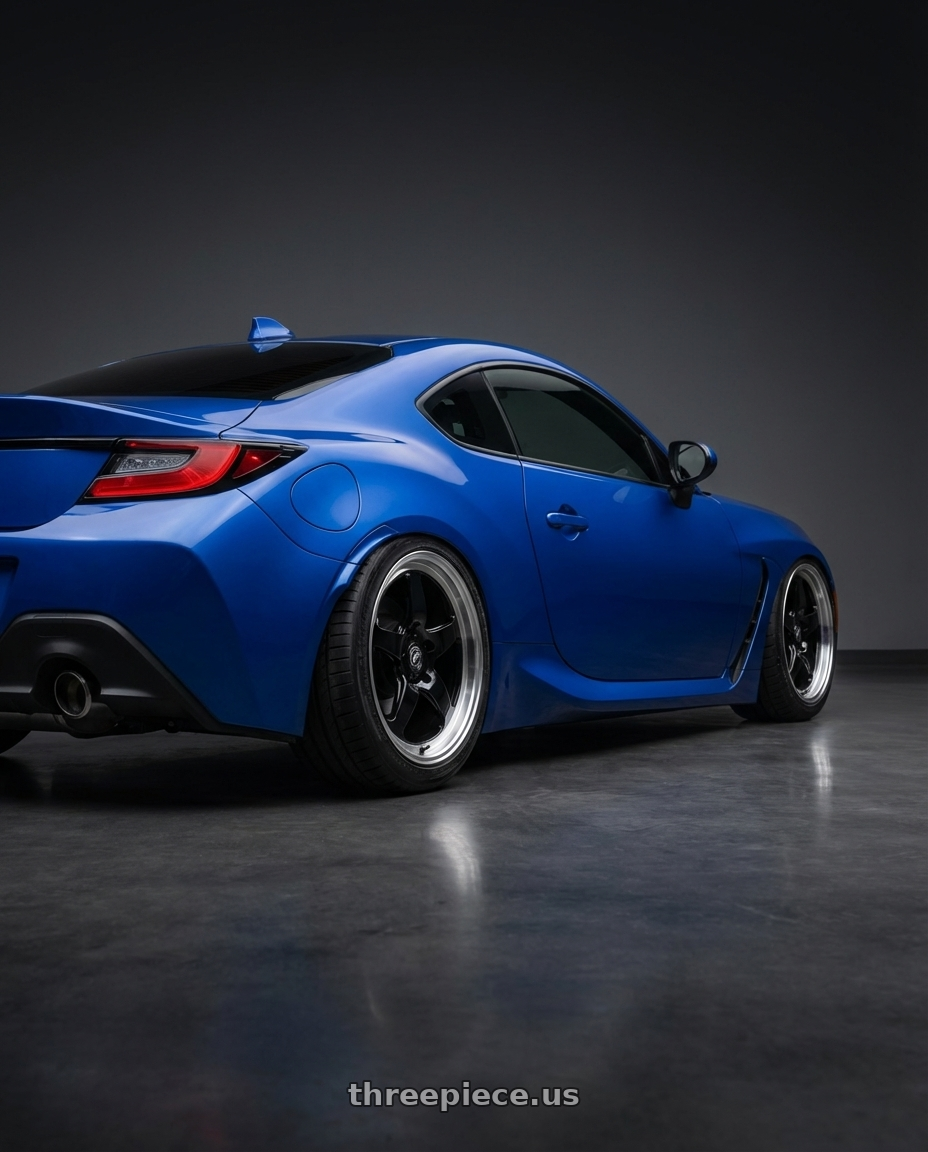 2024 Subaru BRZ with Forgestar D5 Drag 5x114.3 18x10 +22 Gloss Black Machined wheels rear three quarter view slight stretch tires