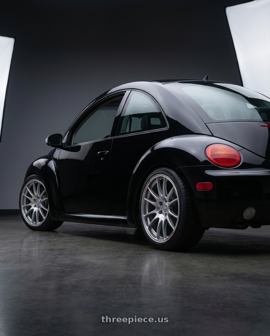 2006 Volkswagen New Beetle with Enkei GTC02 5x120 18x8.5+35 Hyper Silver wheels rear three quarter view square tires