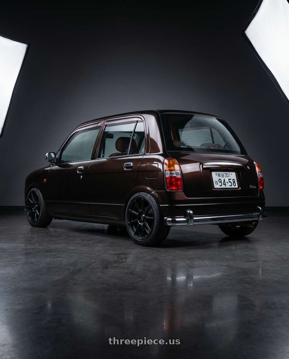 2000 Daihatsu Mira Gino  with Konig Control 4x100/4x108 15x6.5+40 Matte Black wheels rear three quarter view slight stretch tires