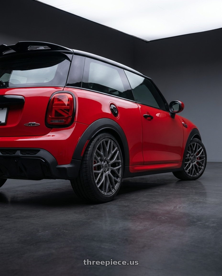 2025 mini jcw red with TOUREN TR76 3276 5x112 18x8 +35 GLOSS GRAPHITE wheels rear three quarter view square tires