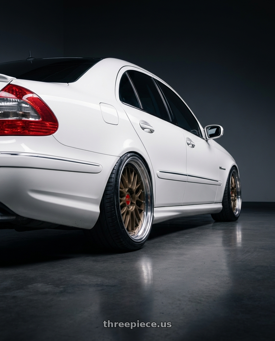 2006 Mercedes E55 AMG with BBS LM 5x112 20x10.0+22 Matte Bronze wheels rear three quarter view extreme stretch tires