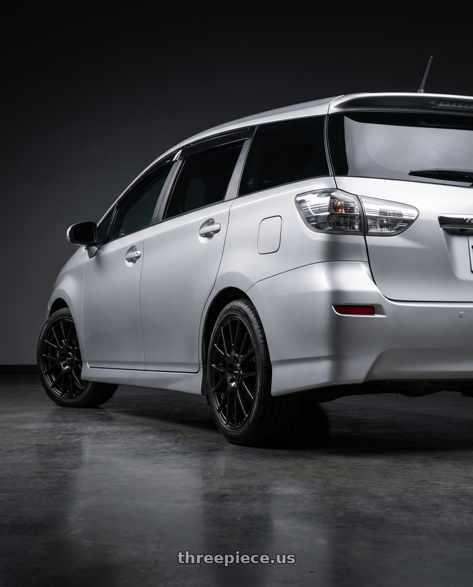 2010 Toyota wish with Vision Street-Designs 18 Hellion 4x100 14x5.5+38 Gloss Black wheels rear three quarter view square tires