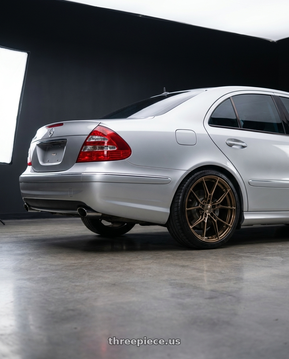 2003 Mercedes Benz E320 Sport with E5 Wheels Daytona 5x120 19x9+35 BRONZE wheels rear three quarter view square tires