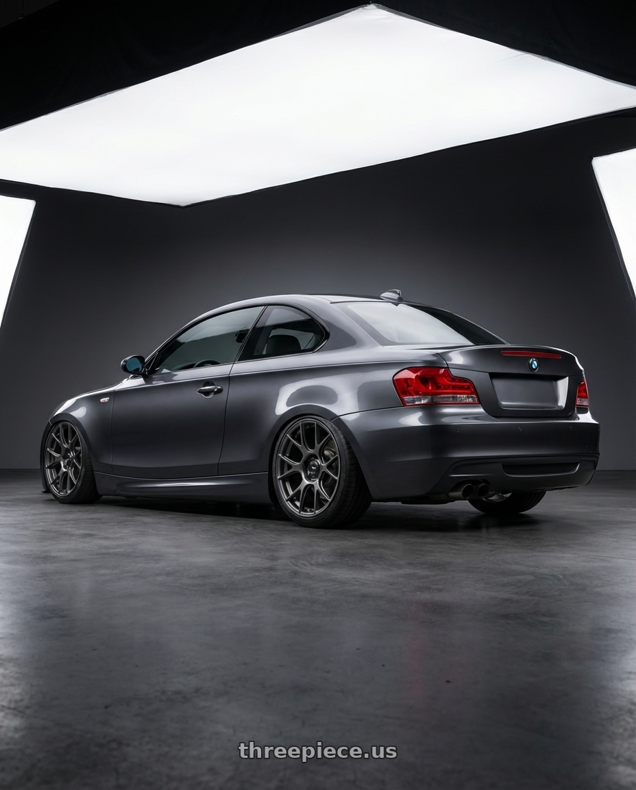 2012 BMW 1 Series E82 with Konig Ampliform 5x120 19x10+28 Dark Metallic Graphite wheels rear three quarter view slight stretch tires