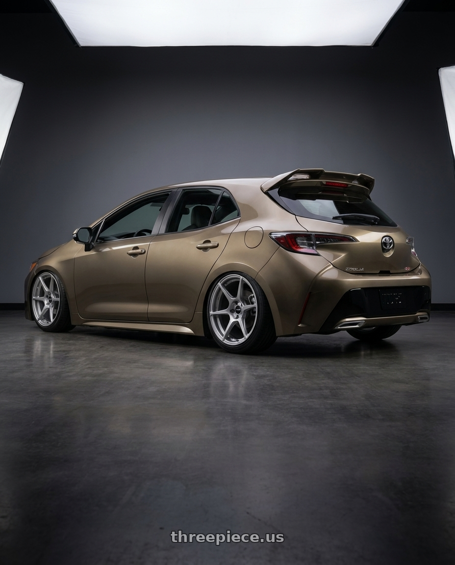 2019 Corolla hatch xse oxidize bronze with spoiler with Enkei TFR 5x100 17x8+45 Storm Gray wheels rear three quarter view slight stretch tires