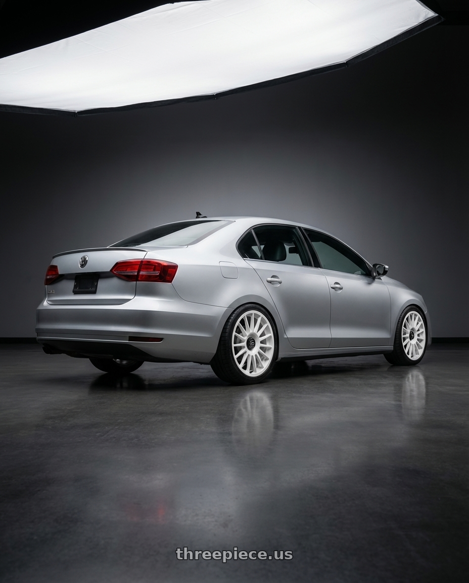 2016 Volkswagen Jetta GLI MK6 with fifteen52 PODIUM 5x112 / 5x120 18x8.5 +35 RALLY WHITE (GLOSS WHITE) wheels rear three quarter view square tires