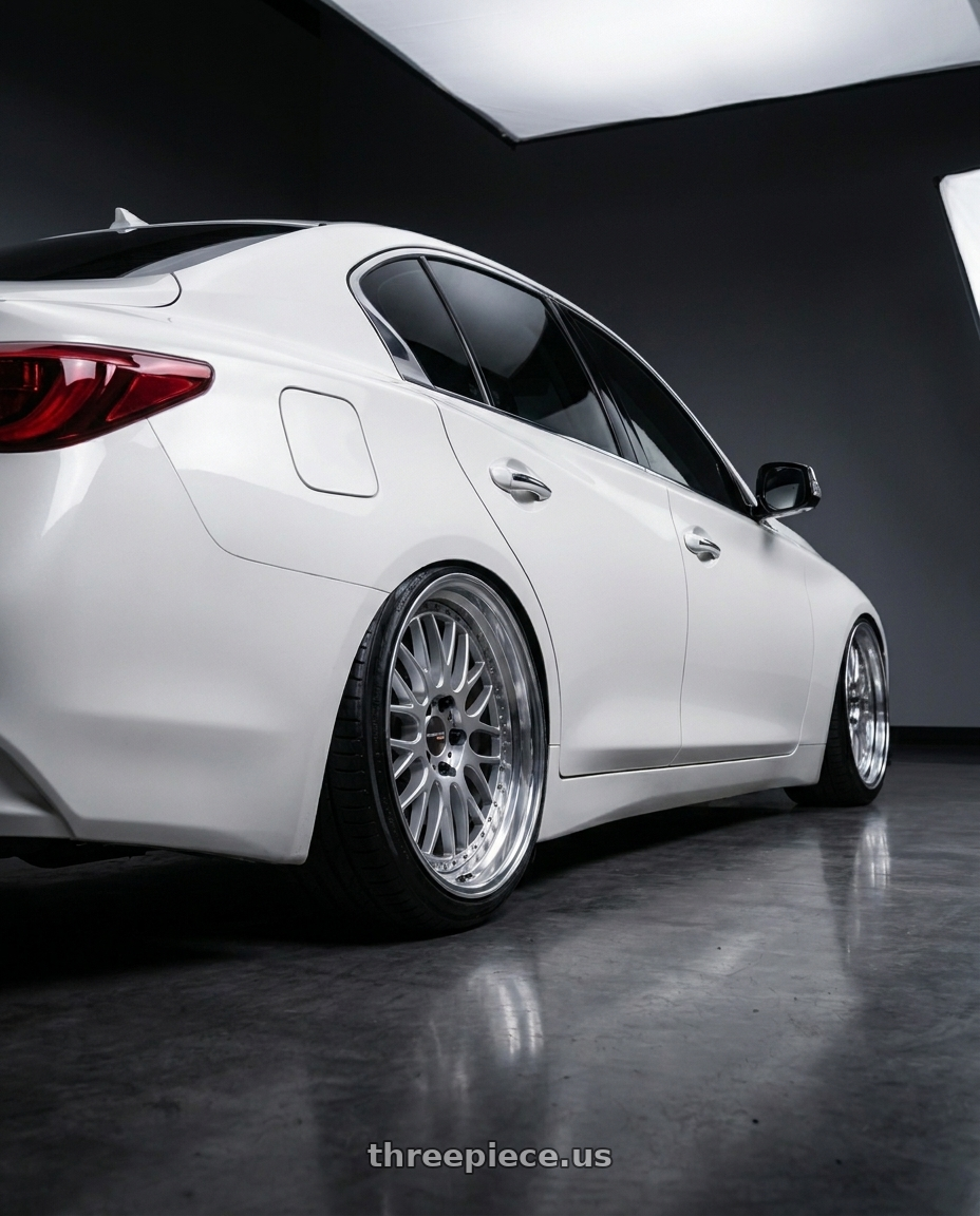 2023 Infiniti Q50s white with Work Emotion Cr 3P 5x100 18x9.5+33 R Disk Burning Silver wheels rear three quarter view slight stretch tires
