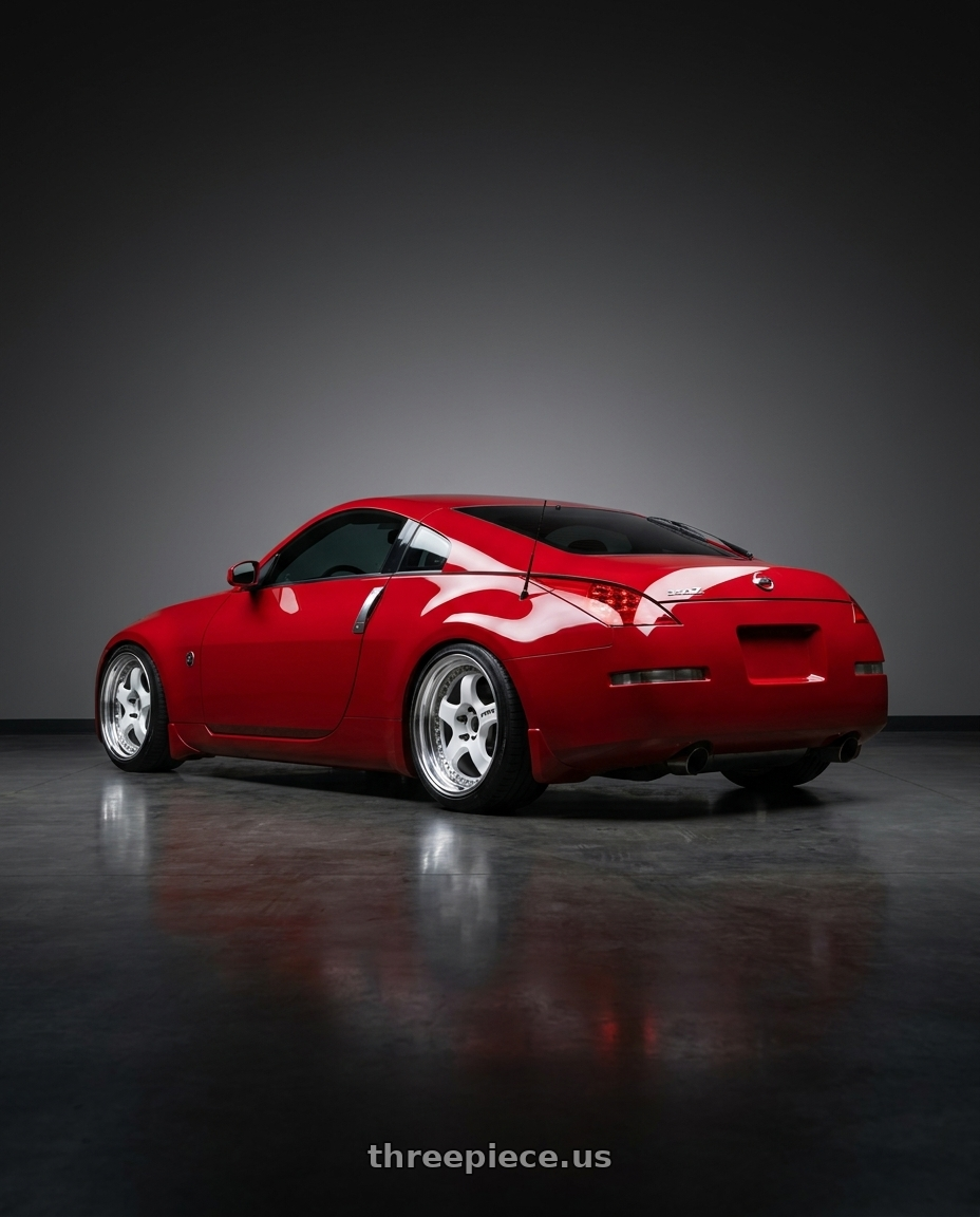 2007 Nissan 350z with Work Meister S1 3P 5x114.3 18x10+22 A Disk White wheels rear three quarter view slight stretch tires