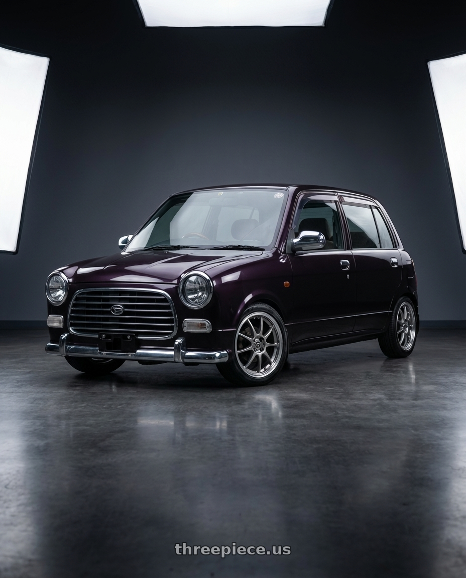 2000 Daihatsu Mira Gino with Enkei J10 4x100/114.3 15x6.5+38 Silver w/ Machined Lip Dia wheels