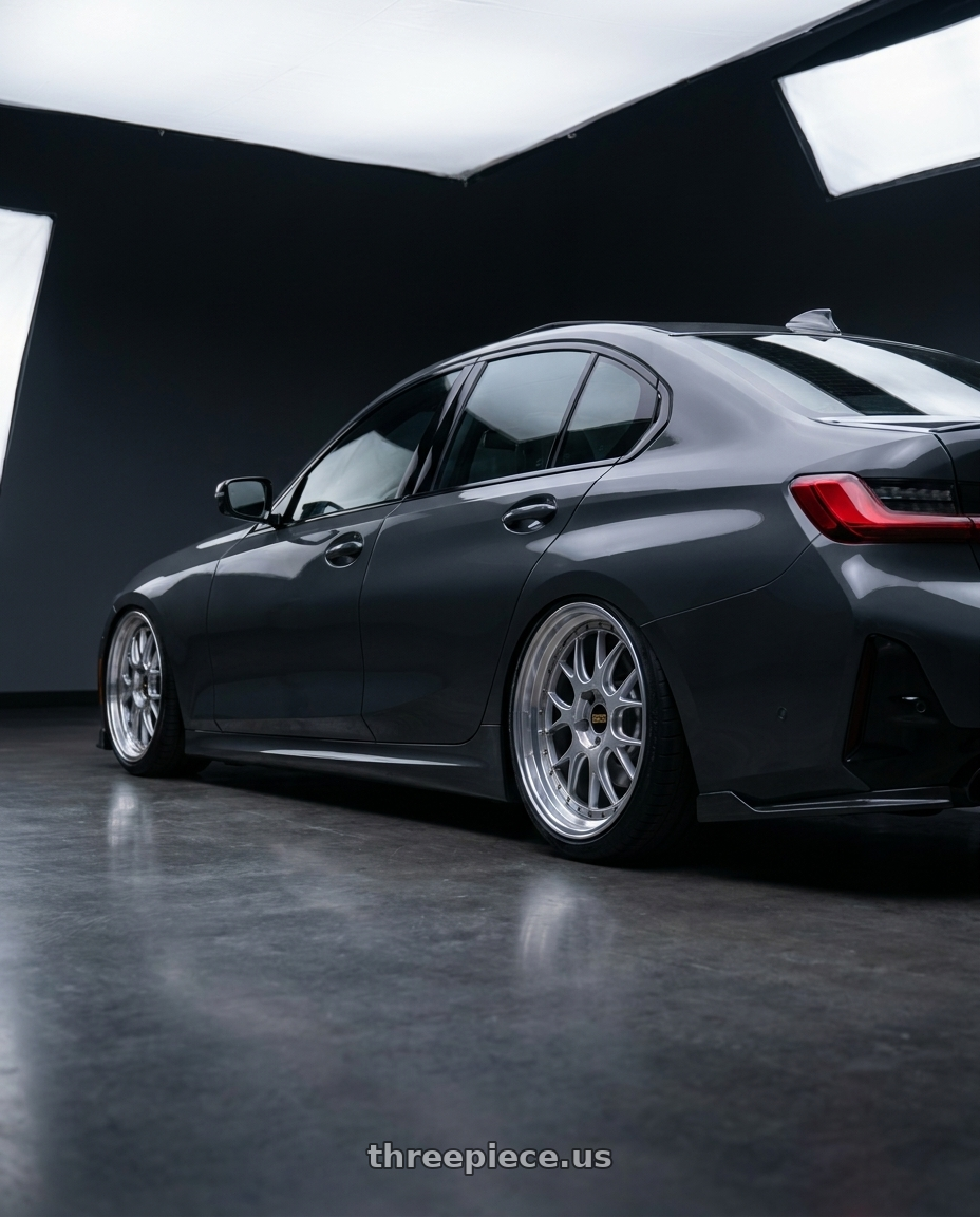 2026 bmw g20 lci 330i  with BBS LM-R 5x112 19x8.5+38 Diamond Silver wheels rear three quarter view slight stretch tires