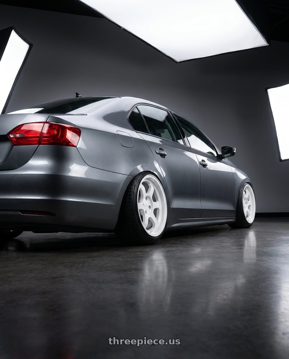 2013 Jetta tsi mk6 with 9six9 SIX-1 Deep 4x100 15X8 +20 Competition White wheels rear three quarter view slight stretch tires