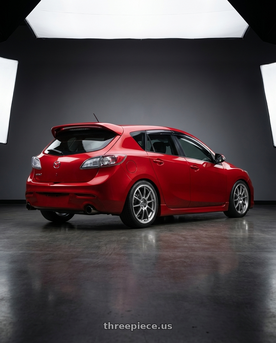 2012 mazdaspeed 3 velocity red mica with Enkei J10 4x100/114.3 15x6.5+38 Silver w/ Machined Lip Dia wheels rear three quarter view square tires