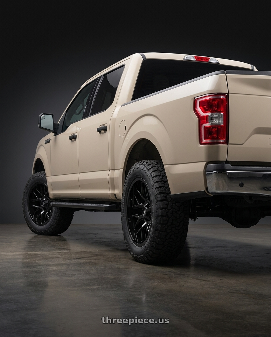2019 Ford F-150 with Gear Off Road 768B 6X135/6x139.7 20x10 -19 Gloss Black wheels rear three quarter view meaty tires