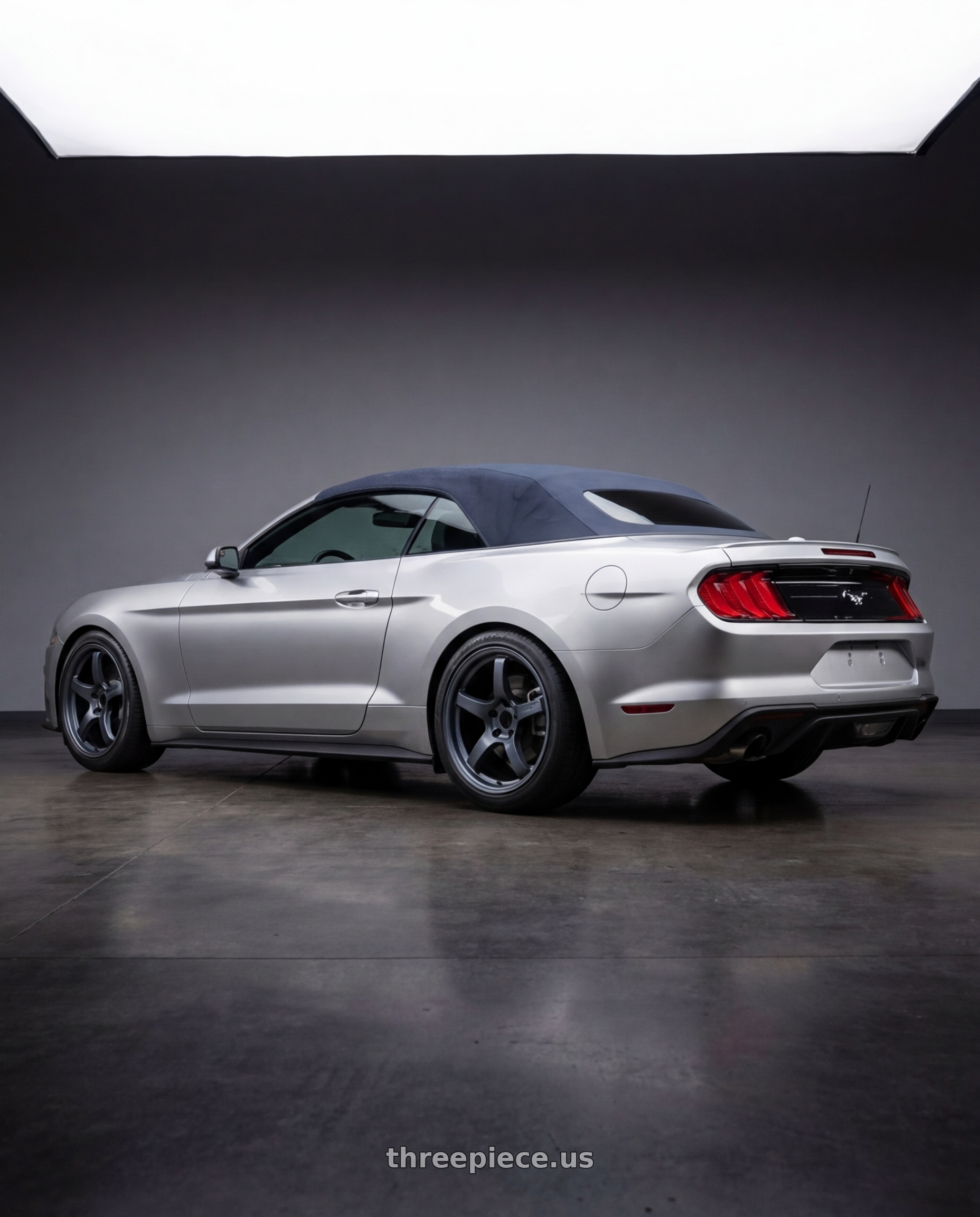 2018 ford mustang with Gram Lights 57CR 5x114.3 19x10.5 +22 GUNBLUE II wheels rear three quarter view slight stretch tires