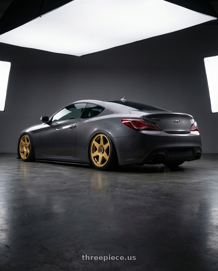 2014 Hyundai Genesis Coupe with fifteen52 TARMAC EVO 5x114.3 / 5x120 19x8.5 +35 GOLD (GLOSS GOLD) wheels rear three quarter view slight stretch tires
