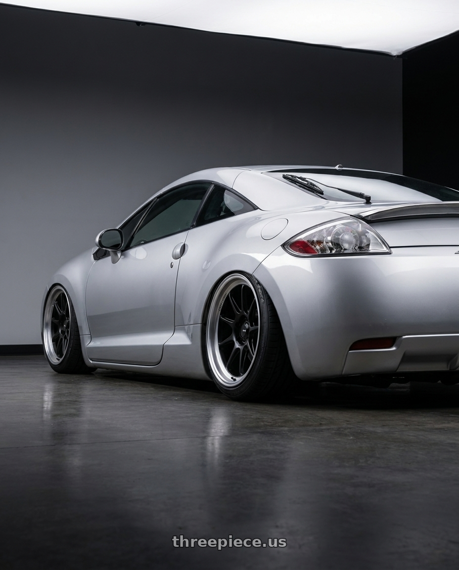 2010 Mitsubishi Eclipse with Konig Countergram 5x114.3 19x9.5+35 Matte Black / Matte Machined Lip wheels rear three quarter view slight stretch tires