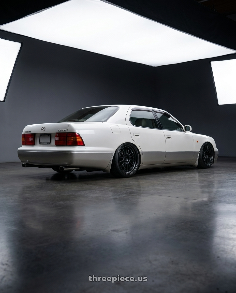 1999 Lexus LS400 with SSR Professor TF1 5x114.3 19X8.5+5 NR Disk Flat Black wheels rear three quarter view square tires